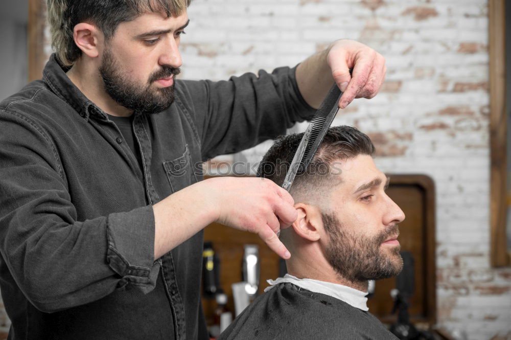 Similar – Barber doing face massage to man