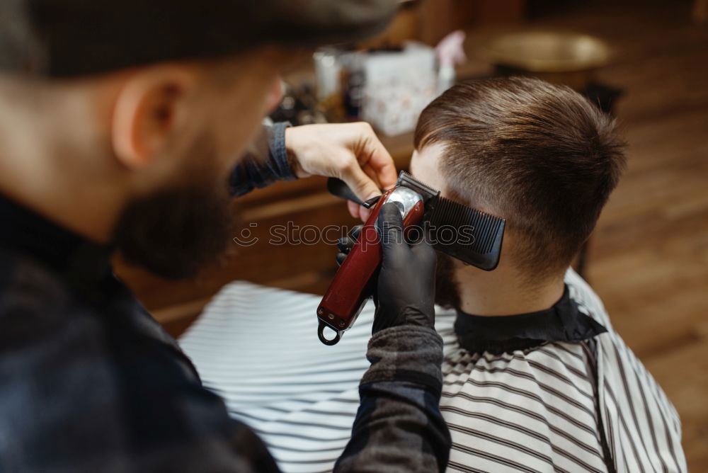 Similar – Image, Stock Photo Barber using grooming machine