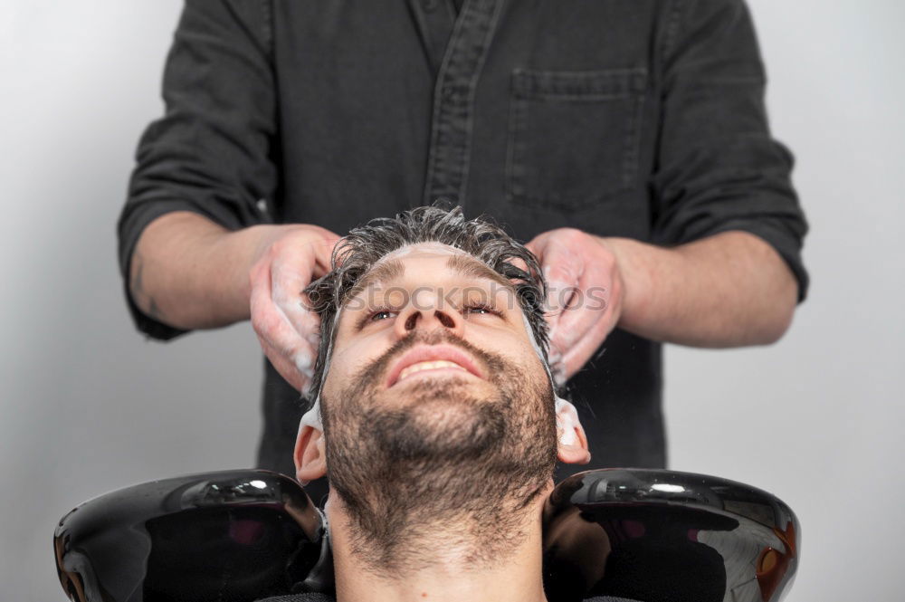 Similar – Barber doing face massage to man