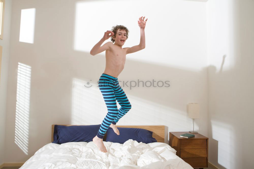 Similar – beautiful kid girl jumping on bed