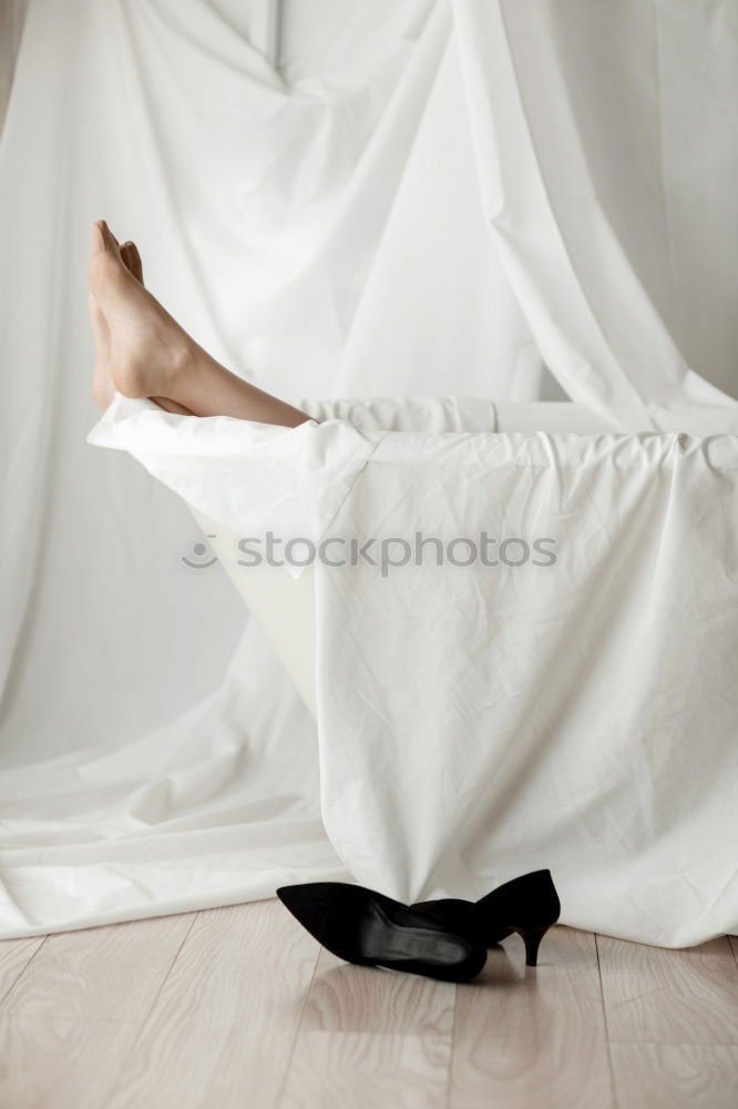 Similar – Image, Stock Photo Woman lying on wooden table with crossed naked strong legs