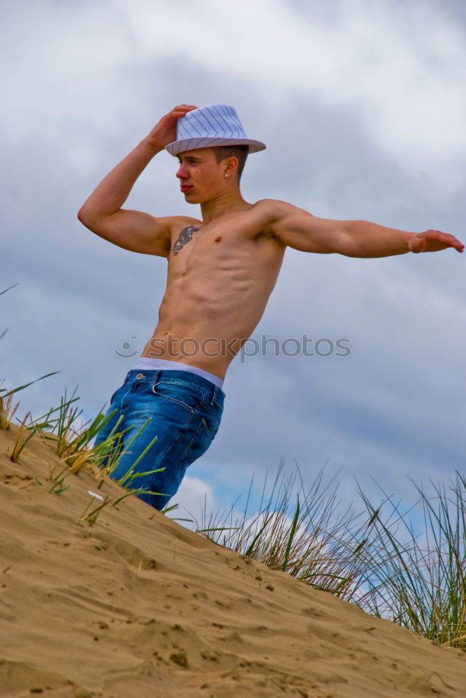 Similar – Young sports man is doing yoga for preparation of his workout