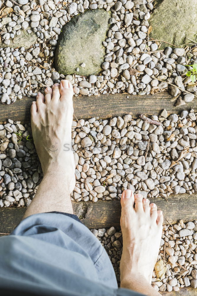 Similar – Barefoot on stone terrace in summer