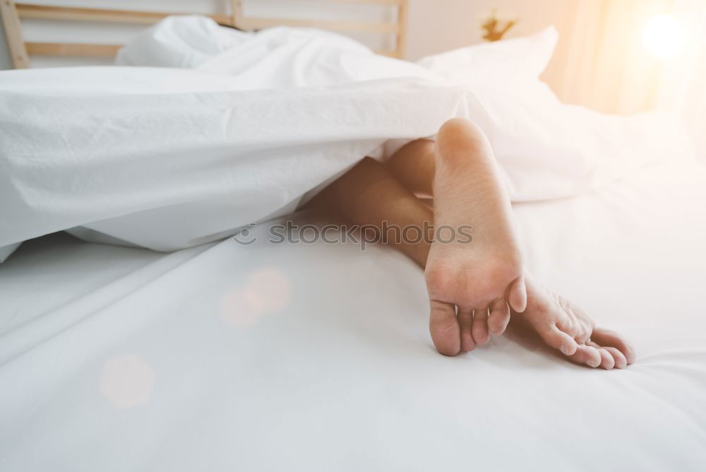 Similar – Image, Stock Photo Woman’s legs in bed on the white wall