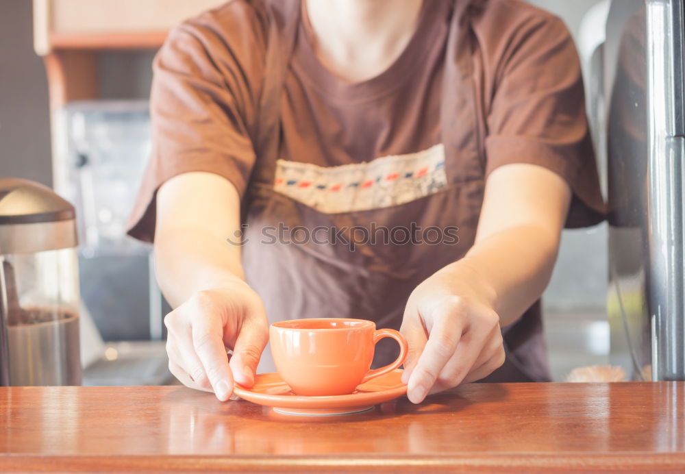 Similar – Image, Stock Photo Barista holds out a Cup of coffee