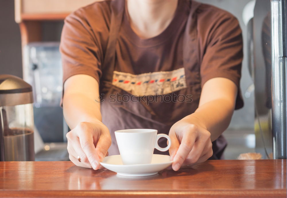 Similar – Image, Stock Photo Barista holds out a Cup of coffee