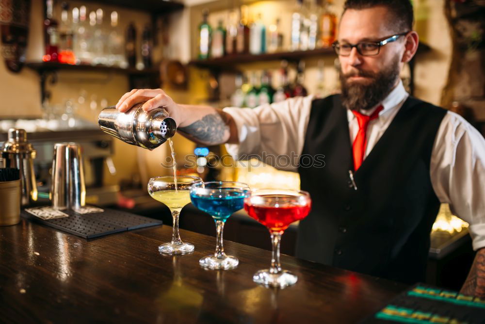 Similar – Barman is making cocktail at night club.