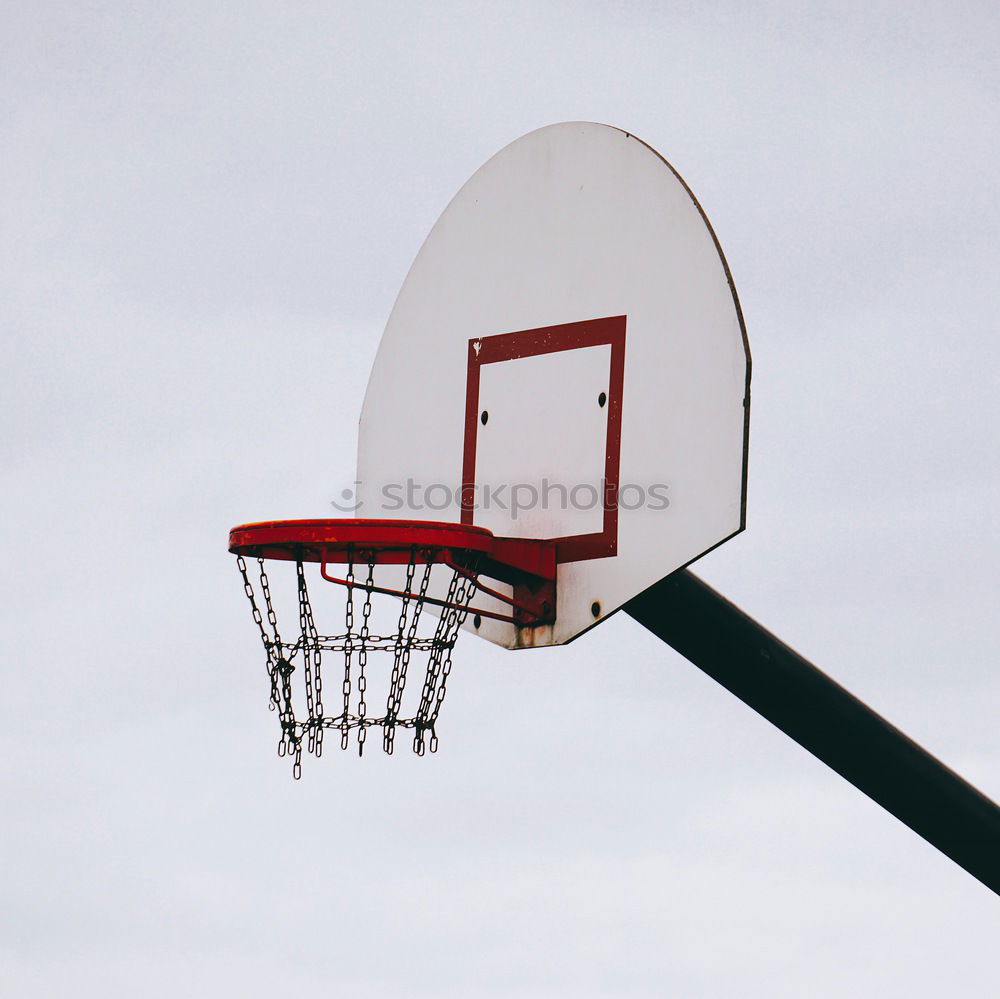 Similar – Alter abgenutzter Basketballkorb mit zerfetztem Netz hängt an einer alten verwitterten Betonmauer