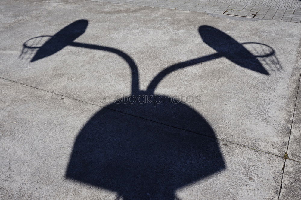 Similar – Schatten von Frau mit Tasche auf Stein