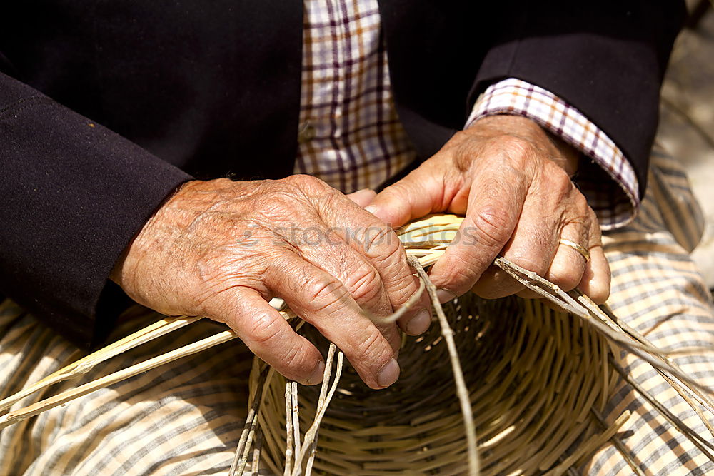 Similar – Close up of the hands of an elderly woman knitting sock