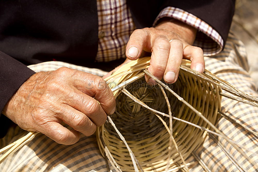 Close up of the hands of an elderly woman knitting sock