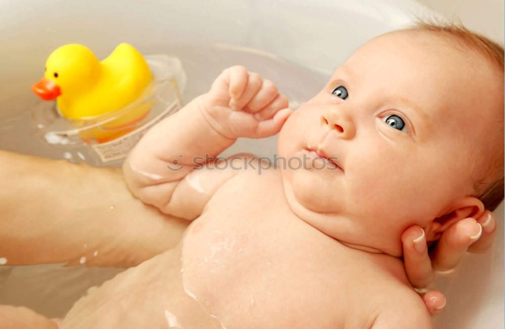 Similar – Bathing newborn baby girl.