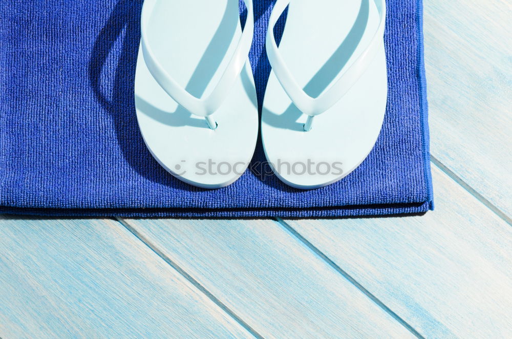 Similar – Cooking spoon and tea towel on blue wooden background