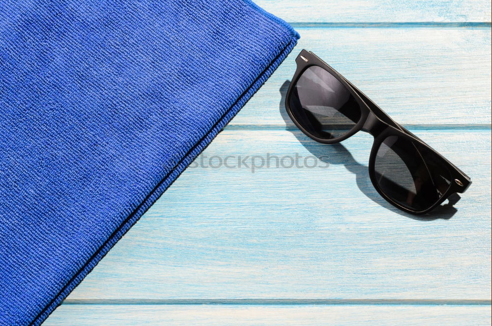 Similar – Cooking spoon and tea towel on blue wooden background