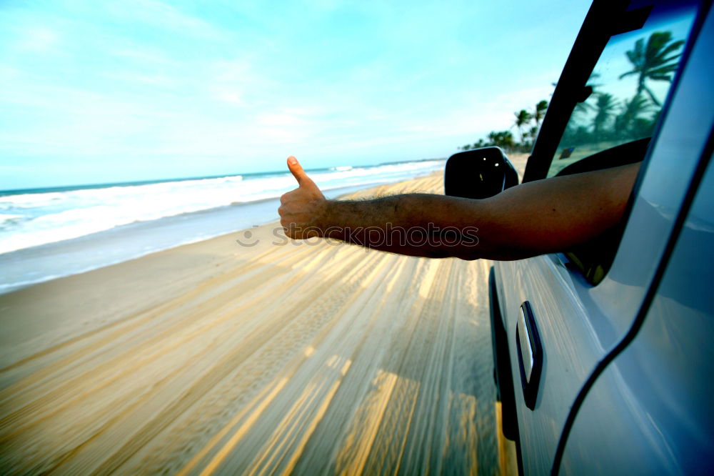 Similar – Unrecognizable man resting feet up sitting on the car