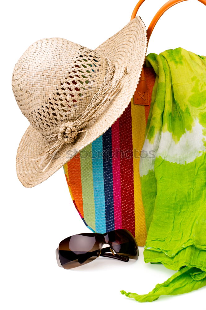 Similar – Draufsicht auf eine Strandtasche mit Flip Flops, Strandtuch, Sonnenbrille, Muscheln und Seesternen