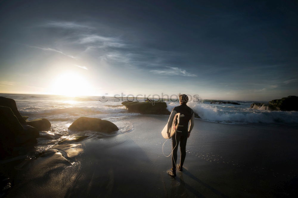 Similar – Foto Bild Mann sitzt am Strand,