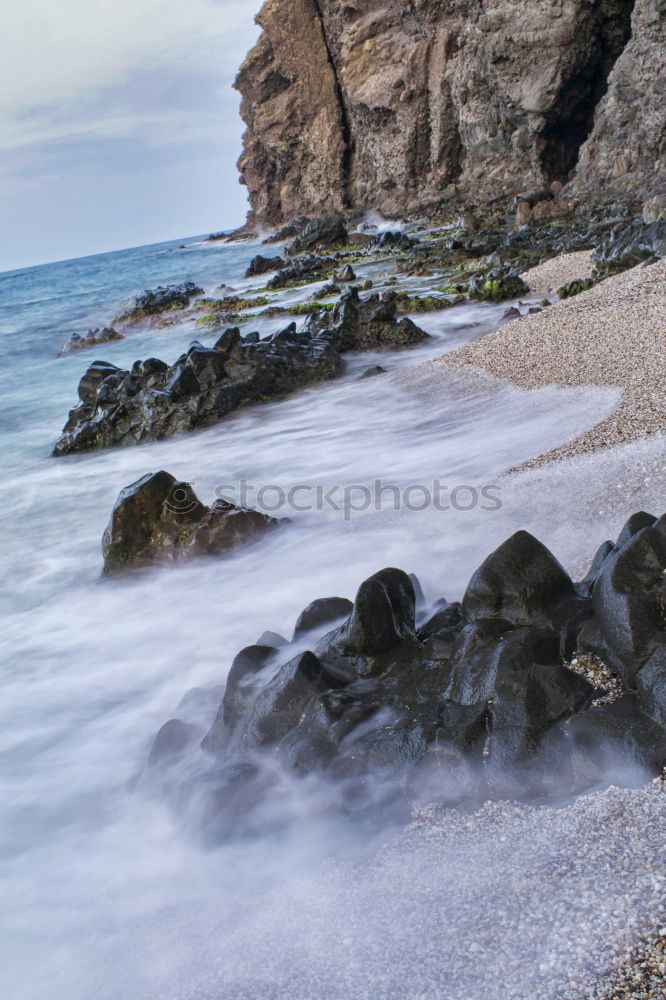 Similar – Rocky coast in the morning light