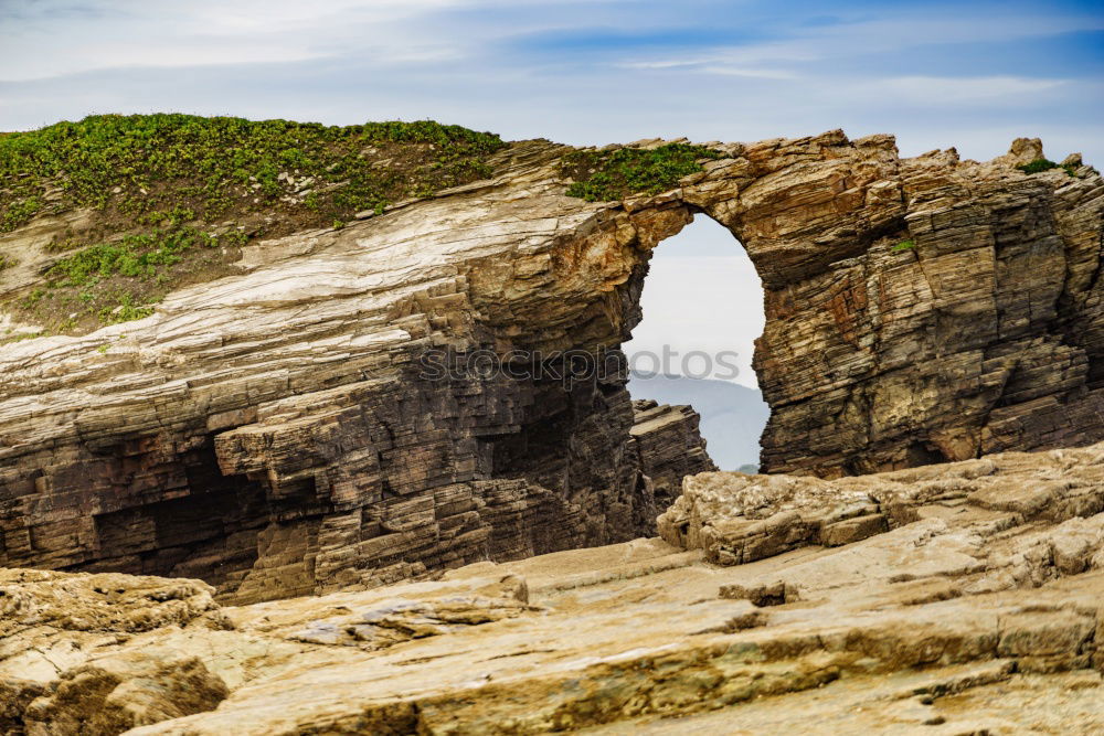 A Natural Arch on the Coast at Golden Hour