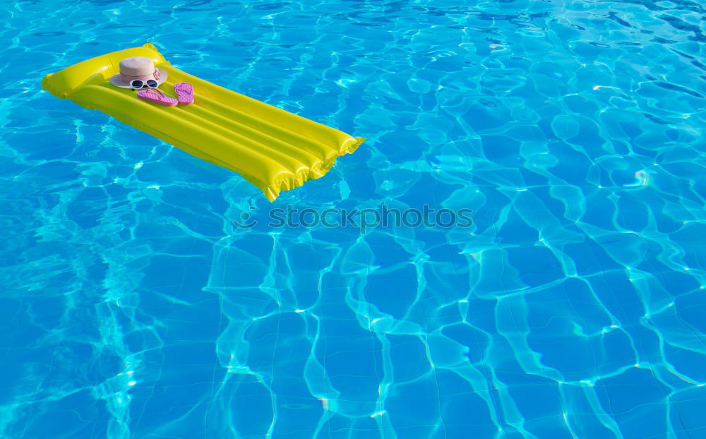 Similar – One little happy boy playing on the inflatable circle in swimming pool at the day time. Concept of friendly family.