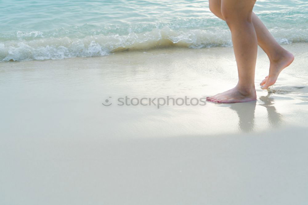 Similar – man takes a beach walk