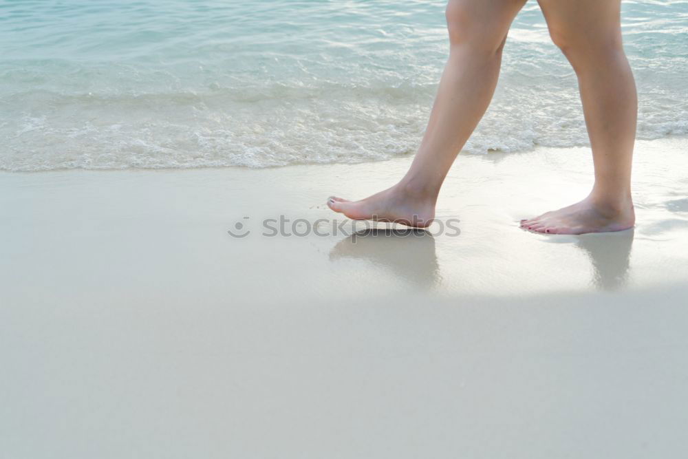 Similar – man takes a beach walk