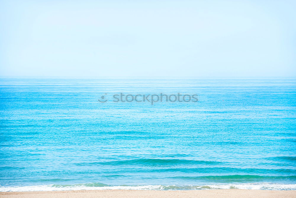 Similar – Beach with calm blue sea and clear sky