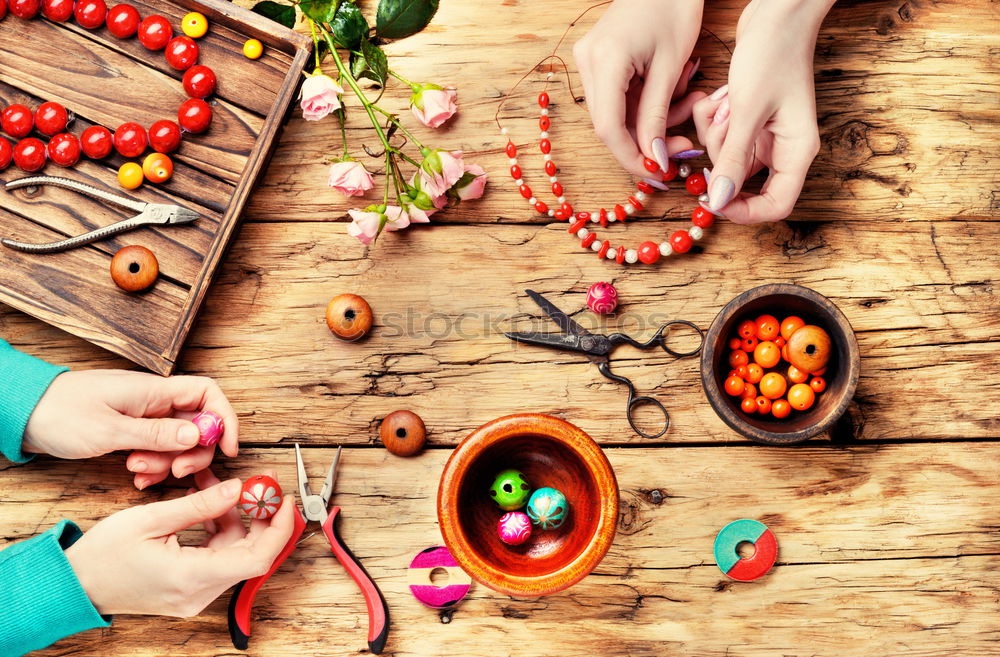 Similar – Image, Stock Photo Making necklaces of colored beads