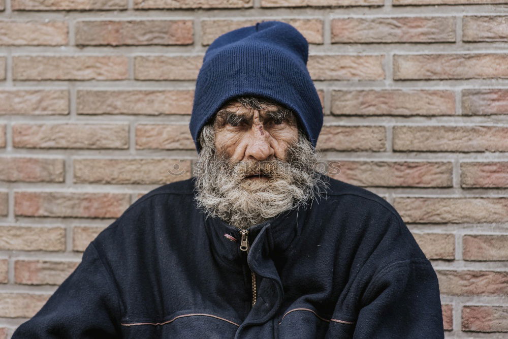 Similar – Happy man with a mustache in a knitted winter cap and warm winter clothing