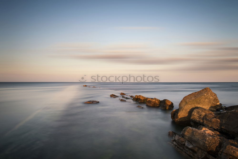 Similar – Rocky coast in the morning light