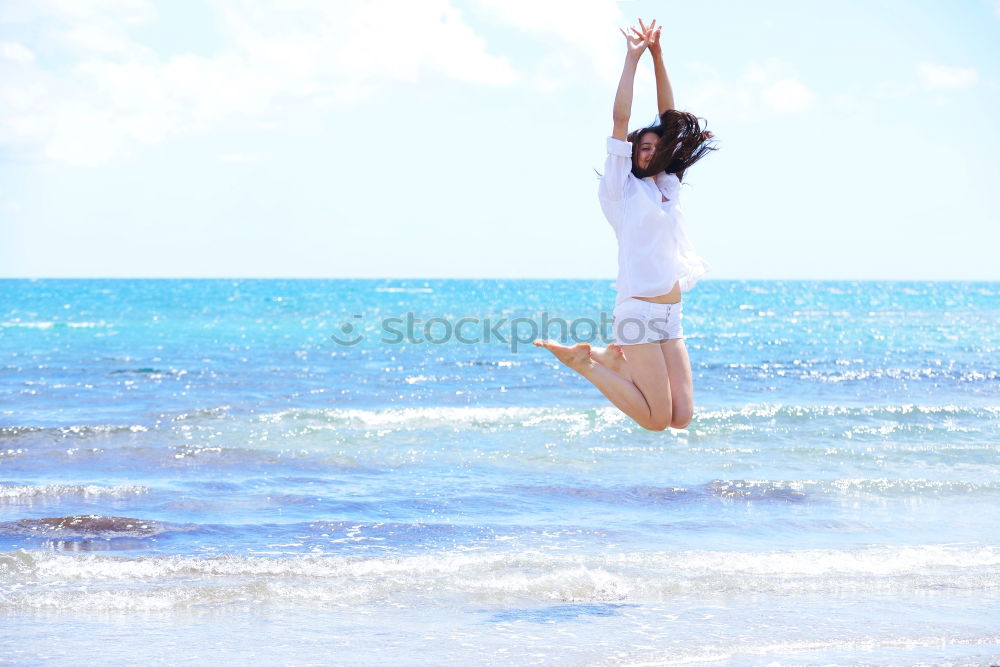 Similar – Happy teen girl jumping on the beach