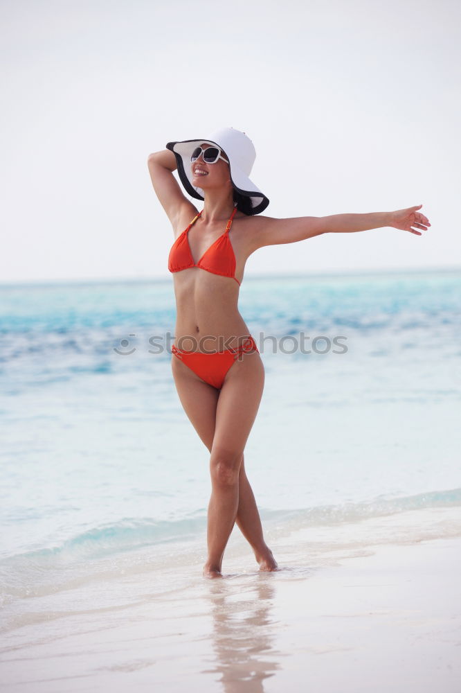 Similar – Image, Stock Photo Woman with beautiful body enjoying her bath on the beach