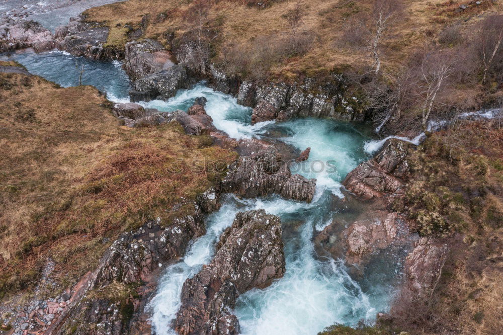 Similar – Image, Stock Photo A wild river flowing through large rocks with moss