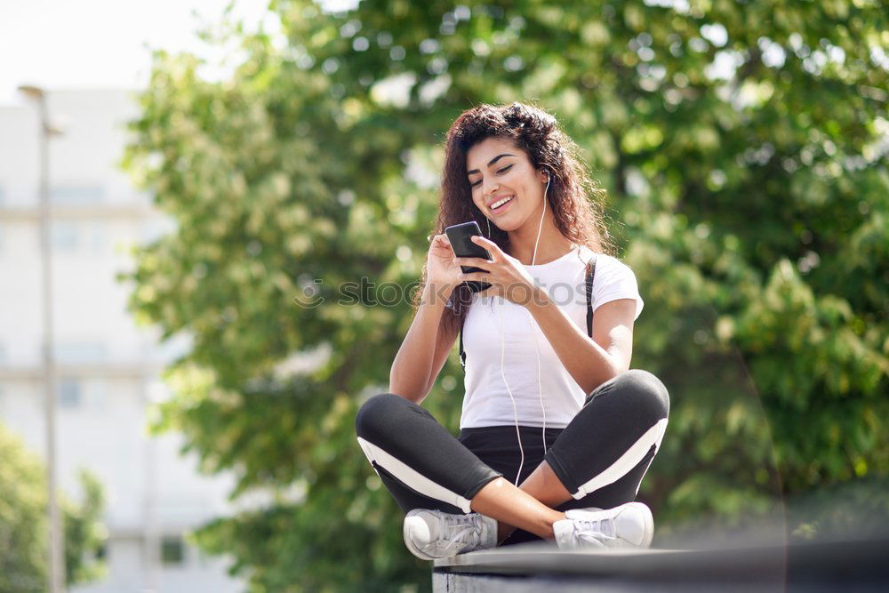 Image, Stock Photo African woman listening to music with earphones and smart phone