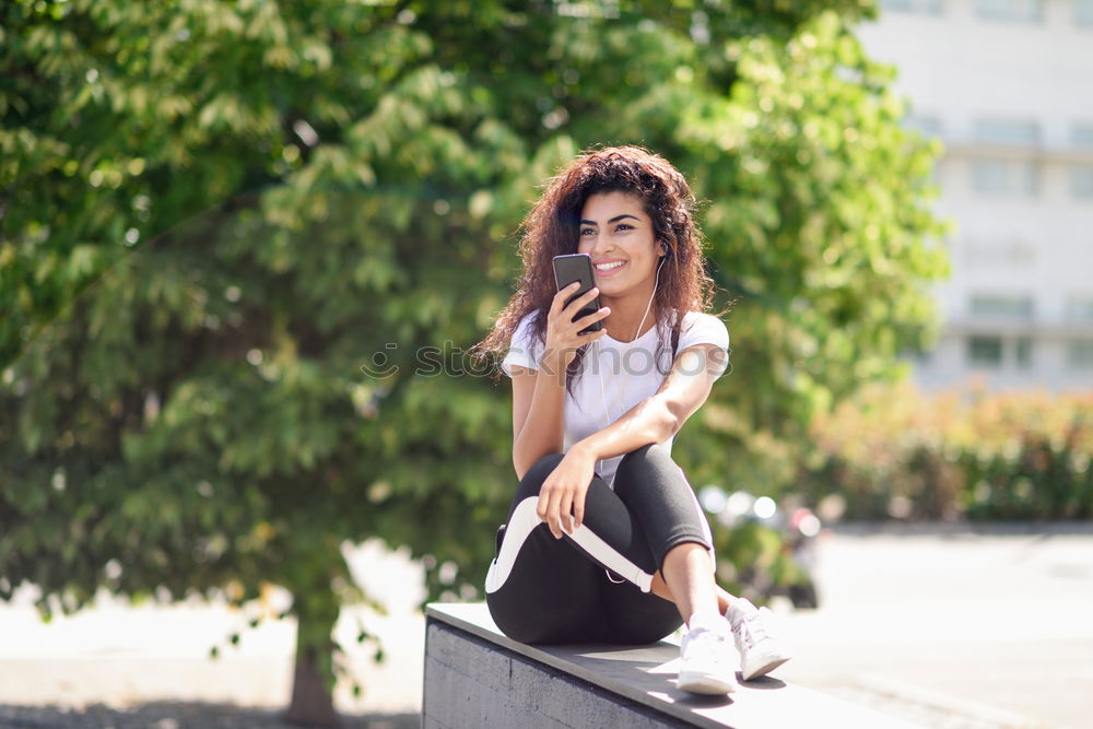 Similar – Front view of a young hipster woman sitting on a park bench relaxing in a sunny day while looking away