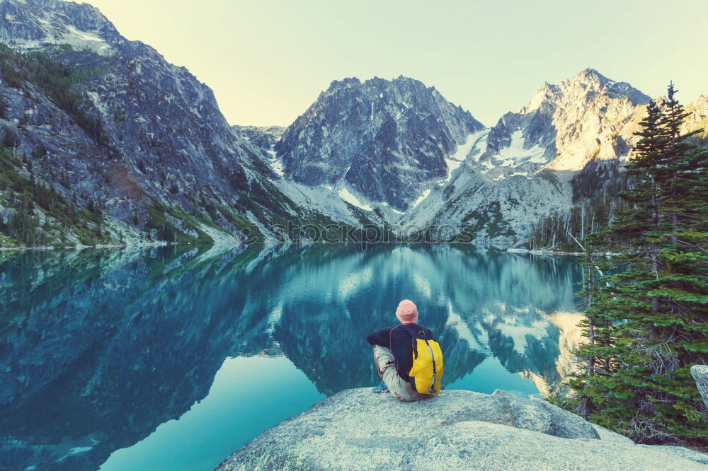 Similar – Women at lake in mountains