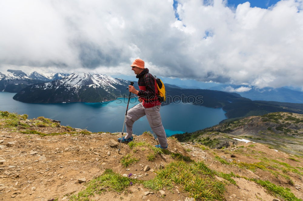 Similar – Image, Stock Photo Climbing sport: young boy takes a rest observing panorama