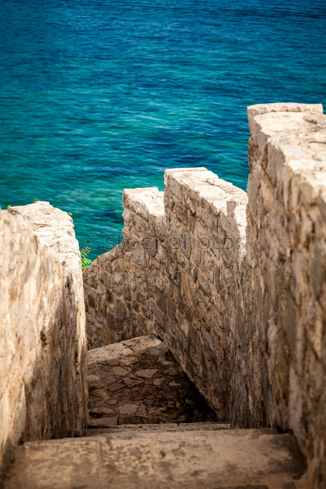 Similar – Image, Stock Photo Bank at the sea in front of wall