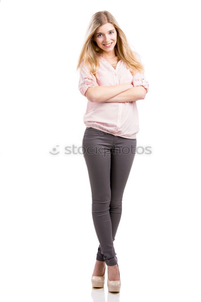 Similar – young redhead woman with curls and freckles stands barefoot in hot pants in front of white door and smiles