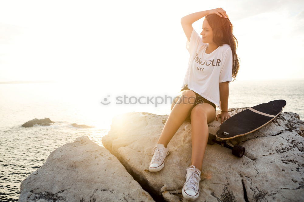 Similar – Beautiful young black woman sitting in a  wooden foot bridge at the beach