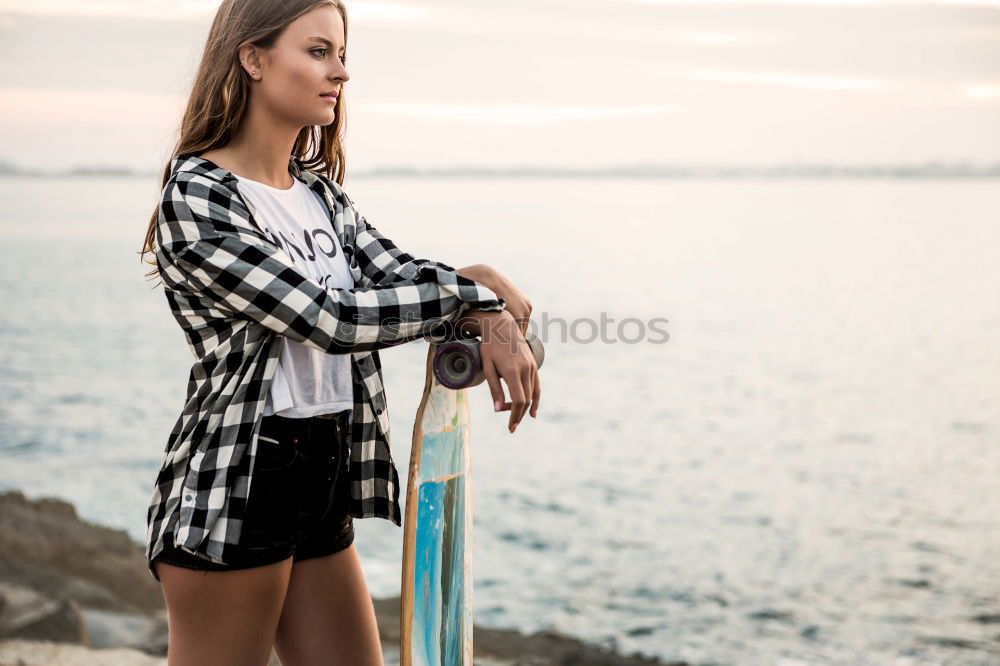 Similar – Image, Stock Photo Smiling young woman relaxing on sidewalk