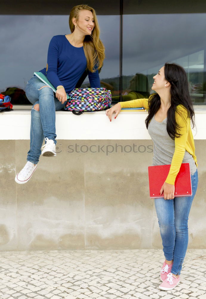 Similar – Two young women talking and laughing on urban steps