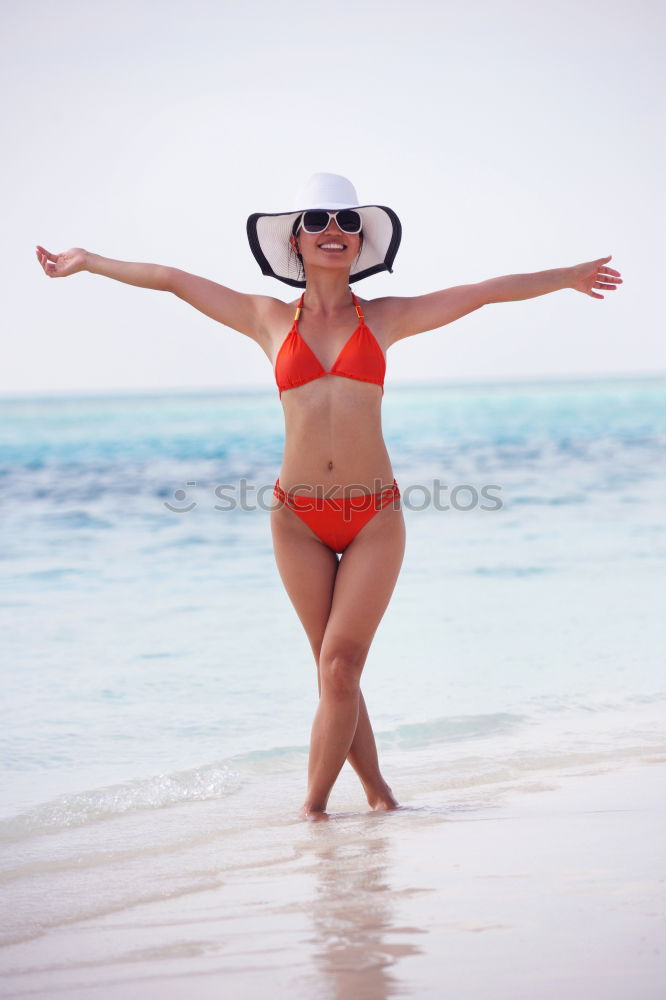 Similar – Image, Stock Photo Woman walking away on the idylic beach.