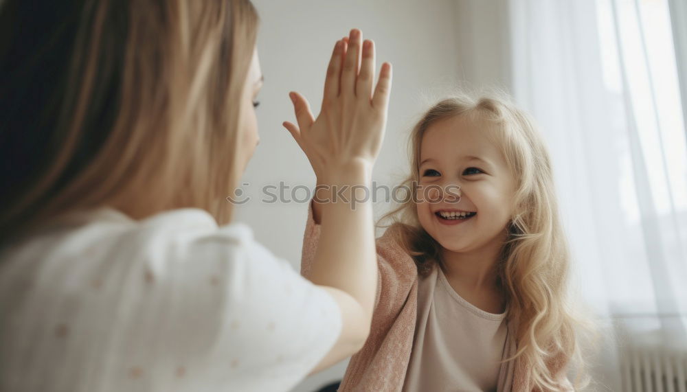 Similar – happy mother and child son fooling and playing in bed