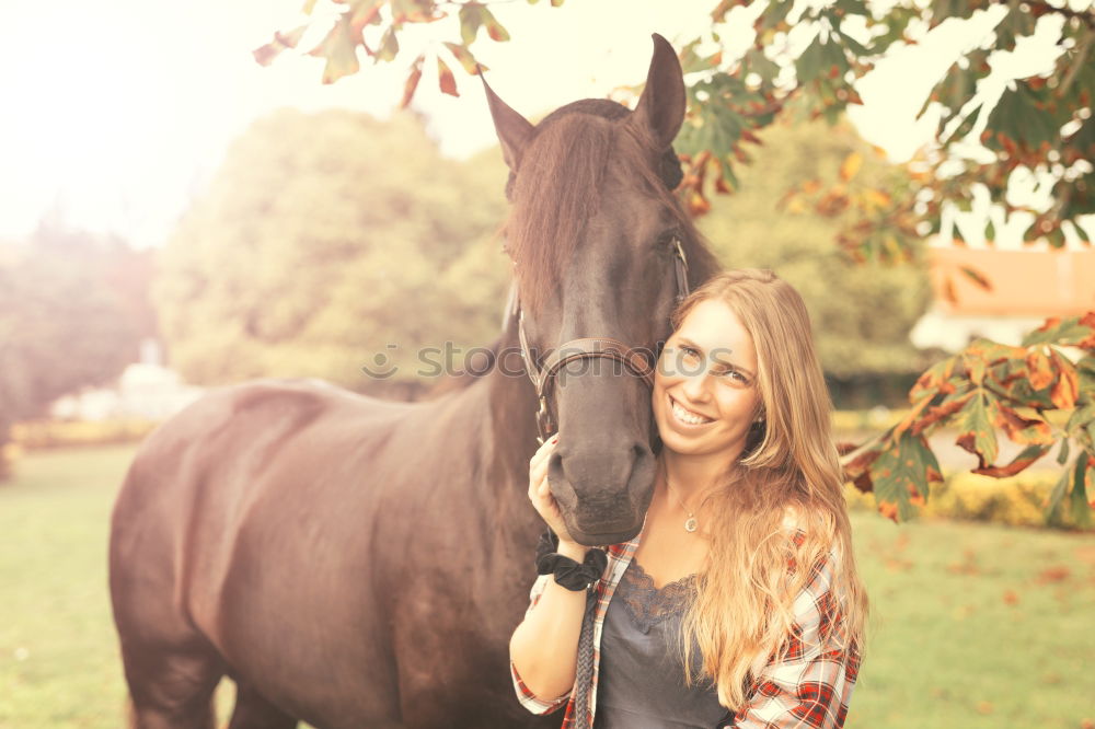 Similar – Image, Stock Photo Beautiful young rider woman with horse in nature. Love and friendship between man and animal. Portrait in landscape near horse stable of riding farm with riding school or farm with pet for hobby riding.