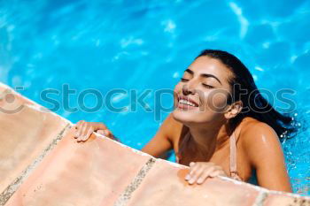 Similar – Beautiful Arab woman relaxing in swimming pool.