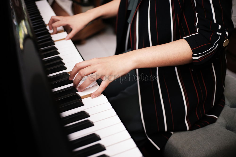 Similar – Image, Stock Photo young woman holding playing piano at home