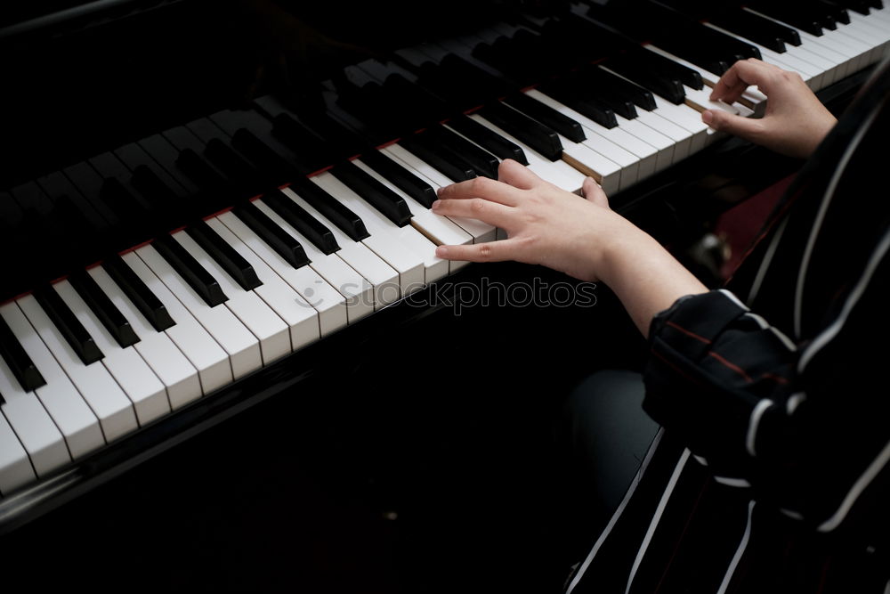 Similar – Image, Stock Photo Young woman playing a piano at home