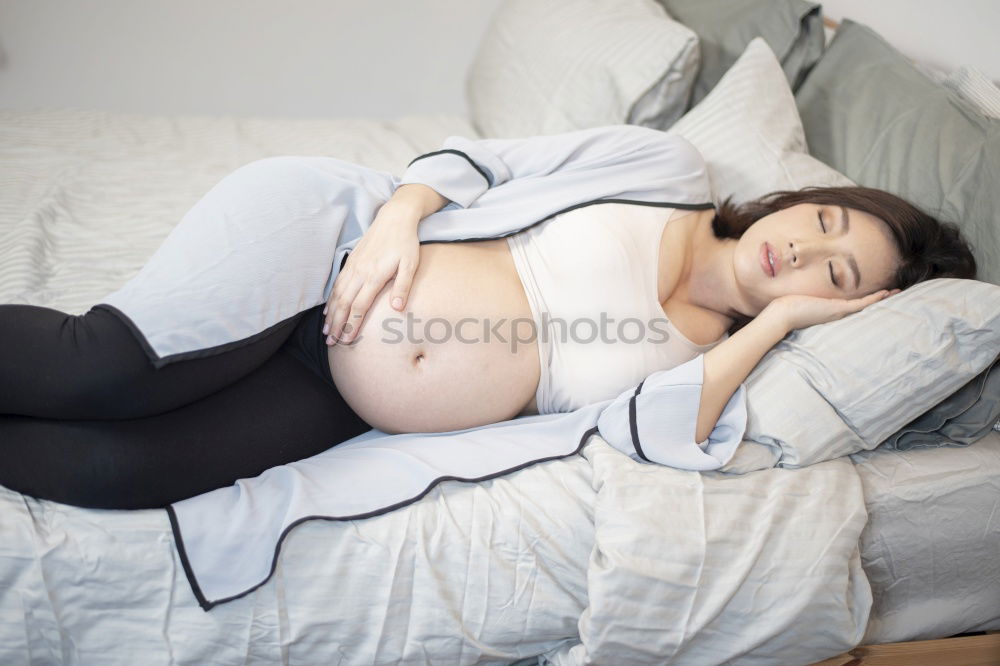 Similar – Pregnant woman touching her belly