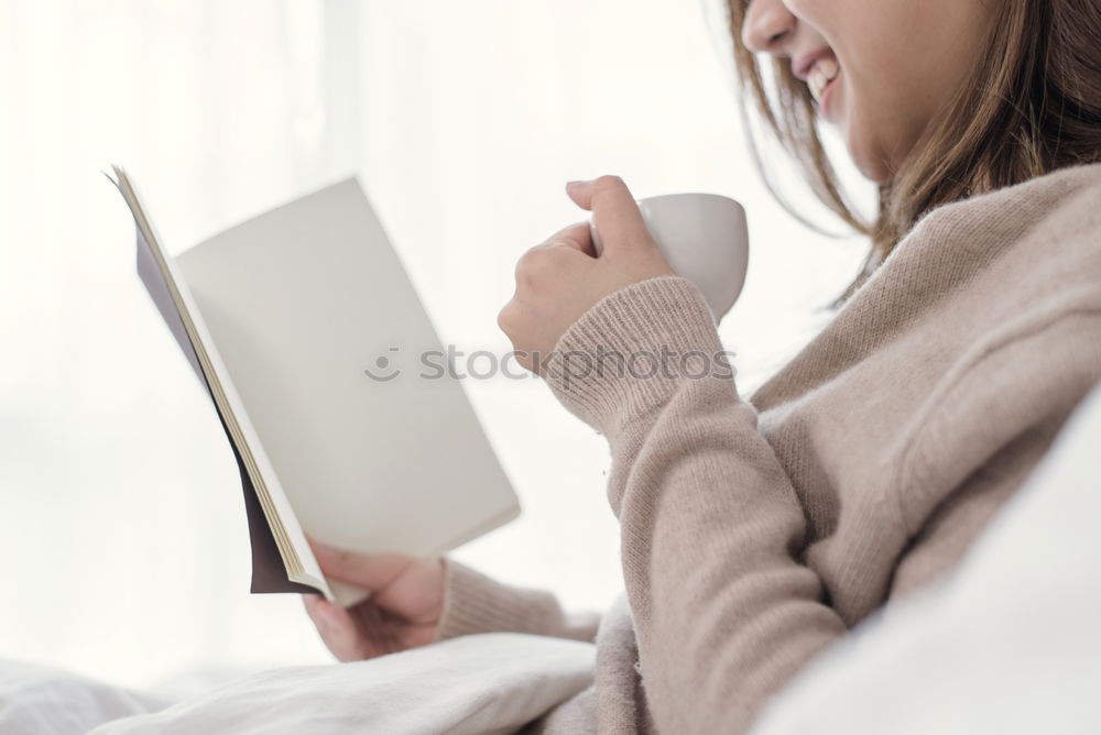 Similar – Image, Stock Photo woman reading a book and drinking coffee on bed with socks